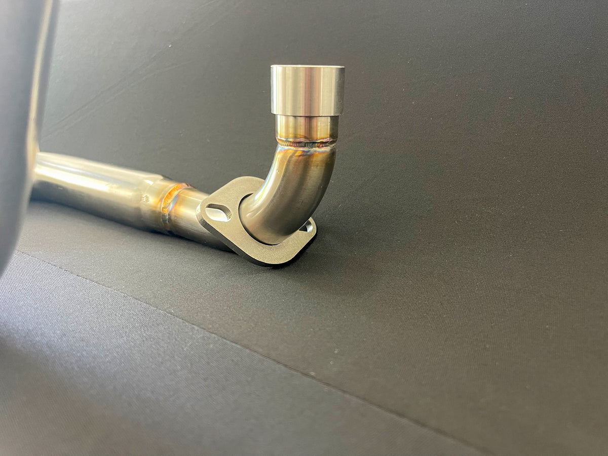 Honda Monkey with Stealth x Kruesi Originals exhaust system – rear angle showing stainless muffler, photo 10 of 12