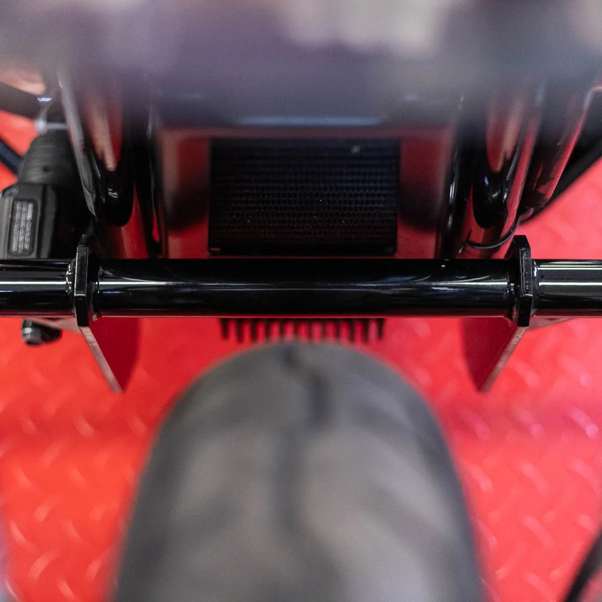 A black Softail Front Crash Bar designed for motorcycles, displayed installed on motorcycle., photo 5 of 10