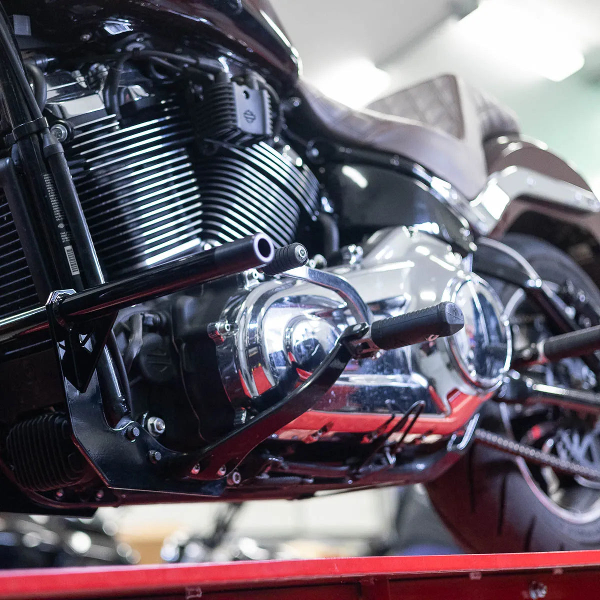 A black Softail Front Crash Bar designed for motorcycles, displayed installed on motorcycle., photo 7 of 10