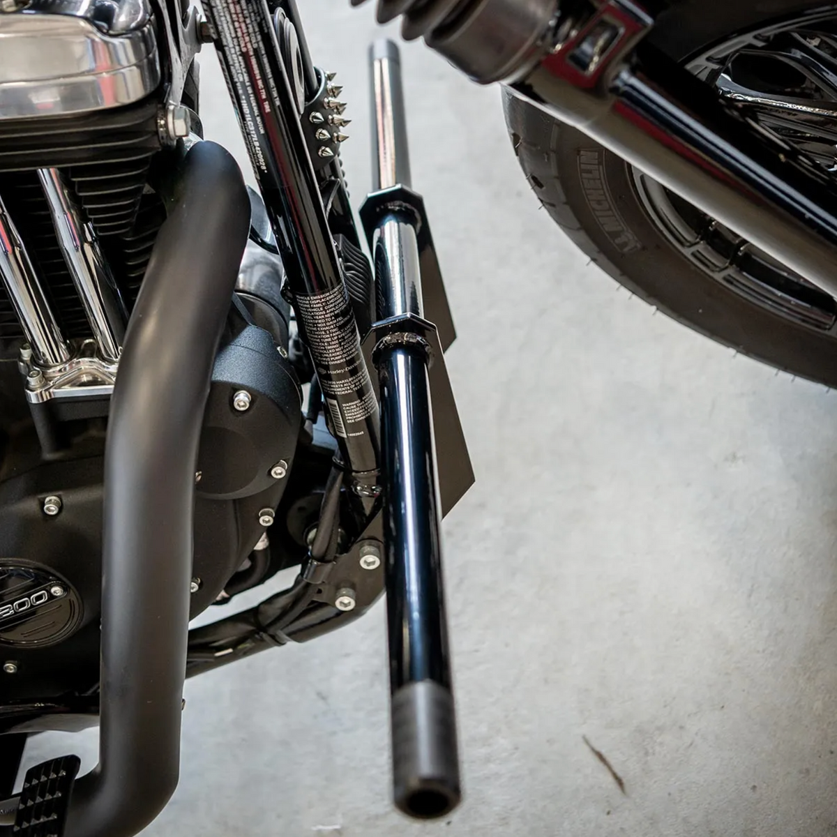 A black front crash bar installed on a Harley Davidson Sportster motorcycle, photo 6 of 6